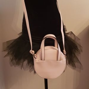 Cute blush pink round crossbody bag.